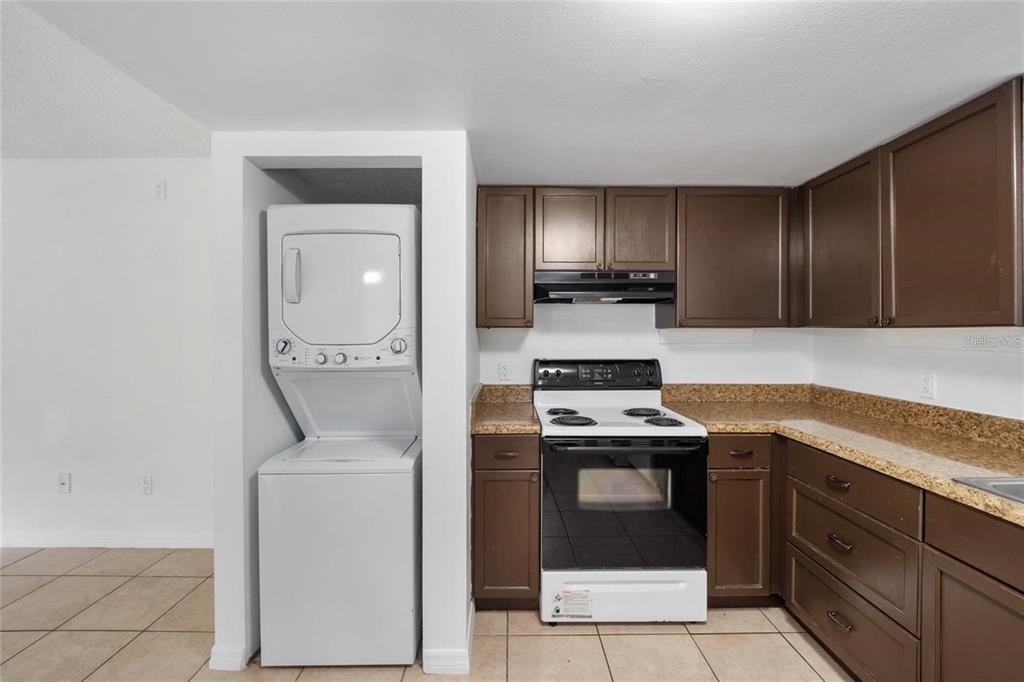8202 Fairways Circle, Unit B202 Ocala, FL 34472 - Photo 12 of 27 a kitchen with a stove and a sink