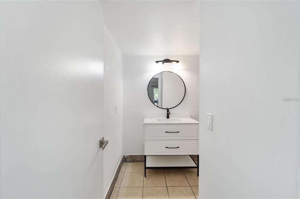 8202 Fairways Circle, Unit B202 Ocala, FL 34472 - Photo 16 of 27 a room with wooden floor and mirror