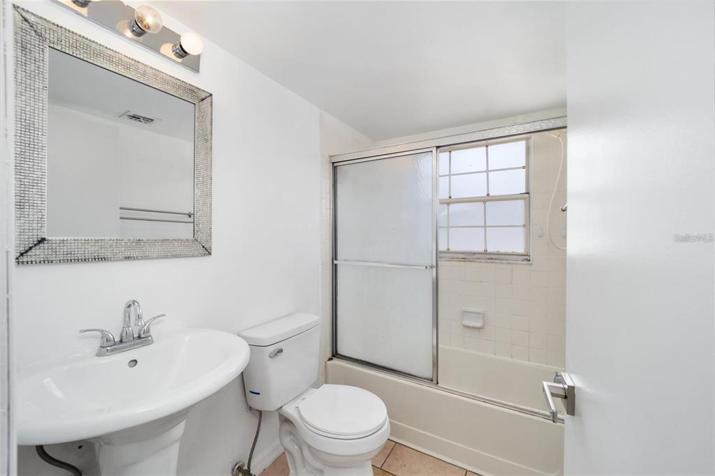 8202 Fairways Circle, Unit B202 Ocala, FL 34472 - Photo 20 of 27 a bathroom with a sink a toilet and shower