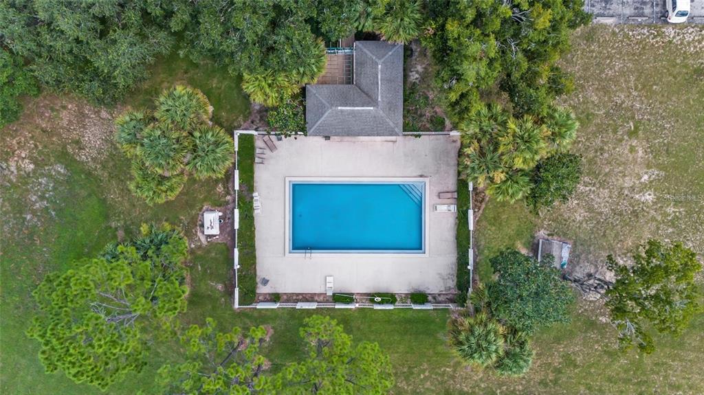 8202 Fairways Circle, Unit B202 Ocala, FL 34472 - Photo 27 of 27 an aerial view of a house with a garden and yard