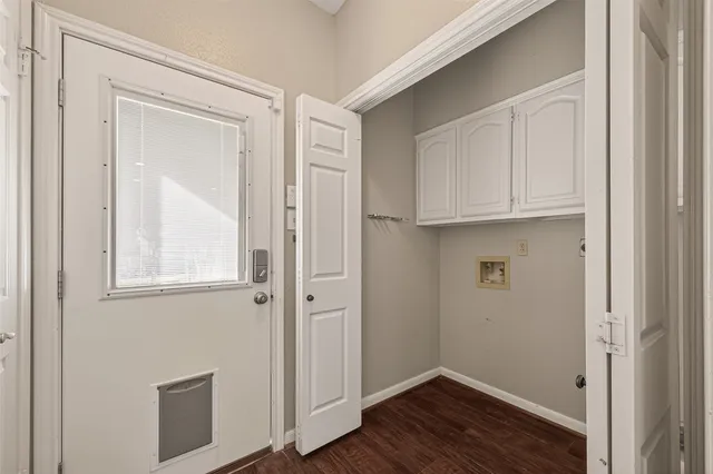 a view of cabinets and wooden floor