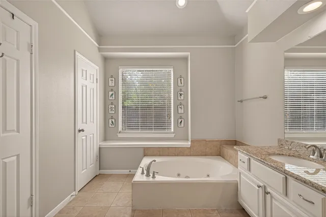 a bathroom with a bathtub and a sink