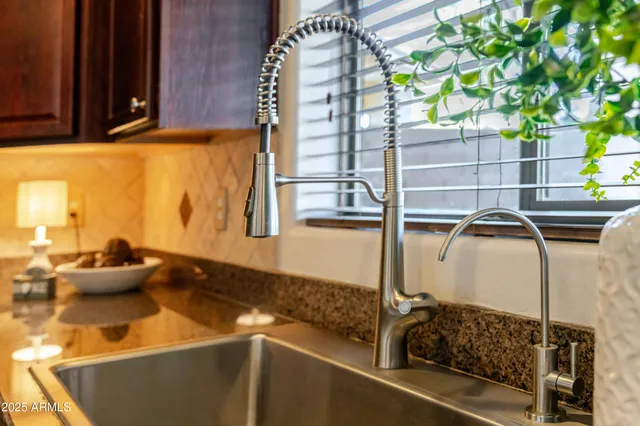 a living room with furniture windows and a flat screen tv