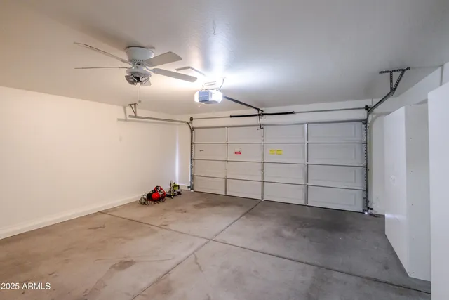 a bathroom with a tub shower and a sink