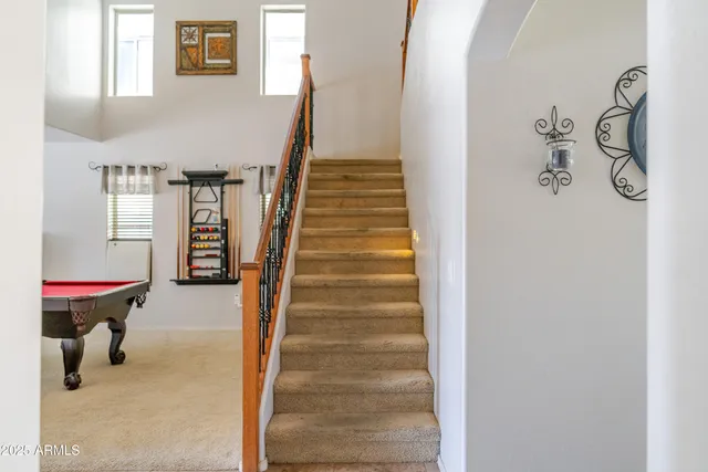 a view of a kitchen with a table and chairs