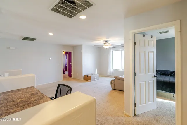 a view of a house with a parking area