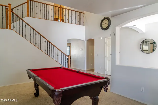 a kitchen with granite countertop a sink a counter top space and stainless steel appliances