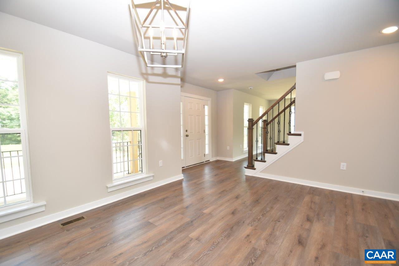 4696 Venable Road Kents Store, VA 23084 - Photo 11 of 28 a view of an empty room with wooden floor and a window