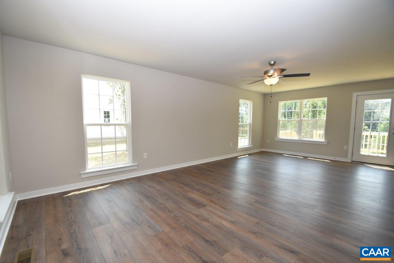 4696 Venable Road Kents Store, VA 23084 - Photo 12 of 28 an empty room with wooden floor and windows