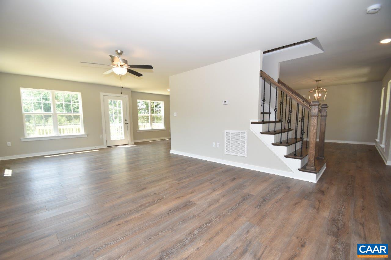 4696 Venable Road Kents Store, VA 23084 - Photo 13 of 28 a view of an empty room with wooden floor and a window