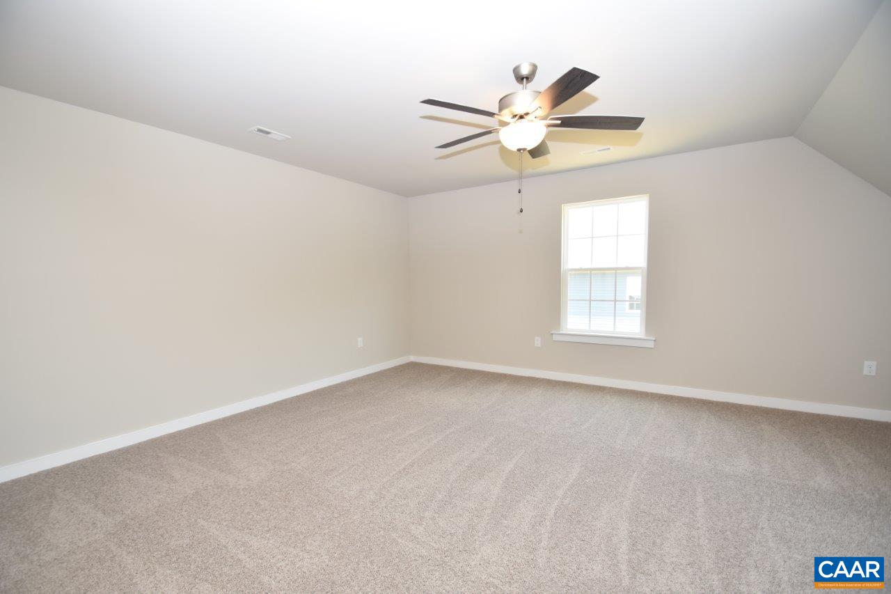 4696 Venable Road Kents Store, VA 23084 - Photo 19 of 28 an empty room with a window and a fan