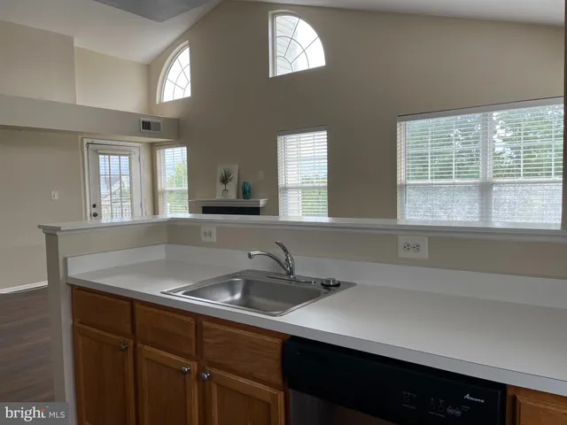 a kitchen with a sink and a window