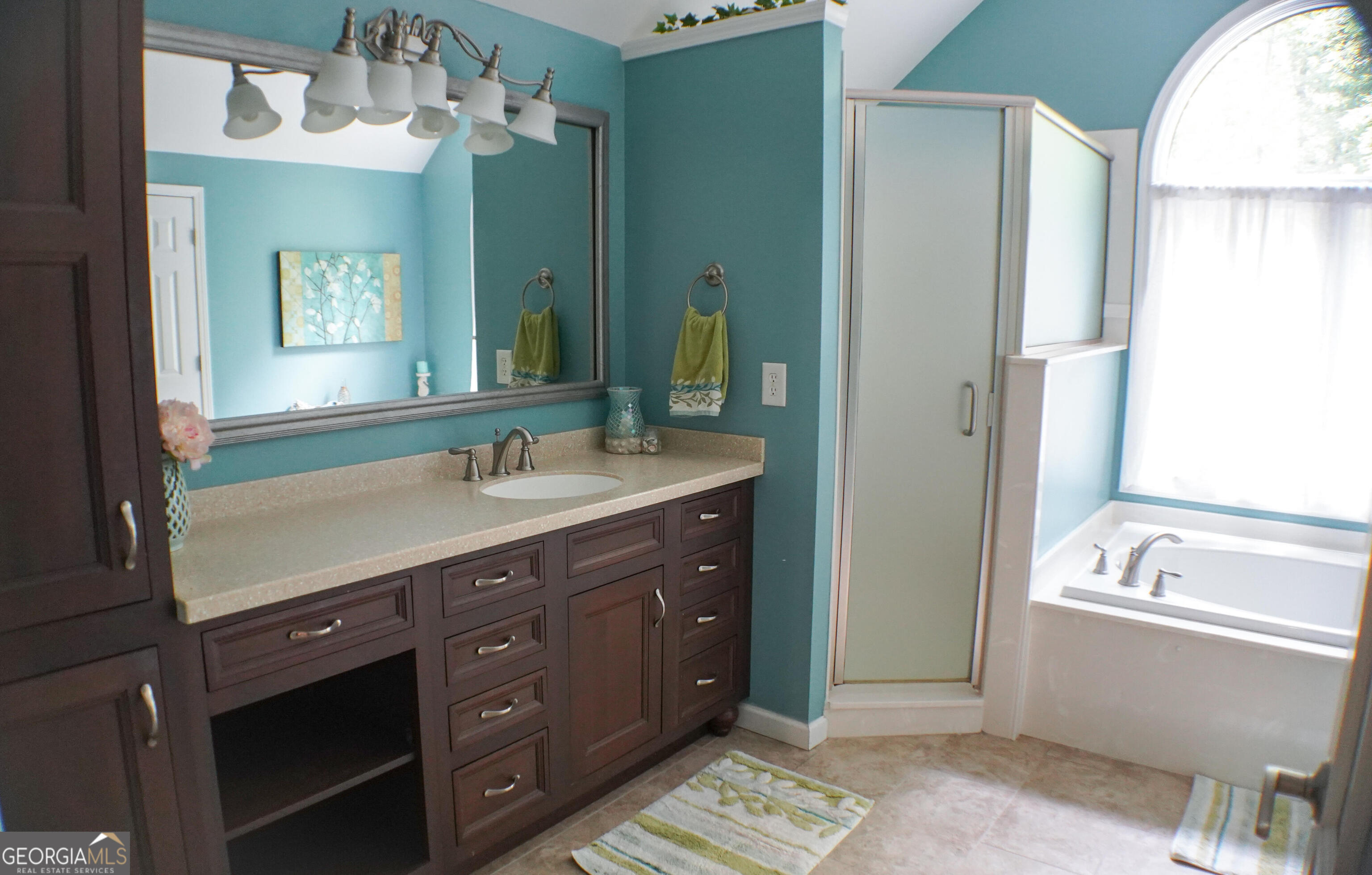 335 Winding Stream Trail Hampton, GA 30228 - Photo 21 of 35 a spacious bathroom with a tub sink and mirror