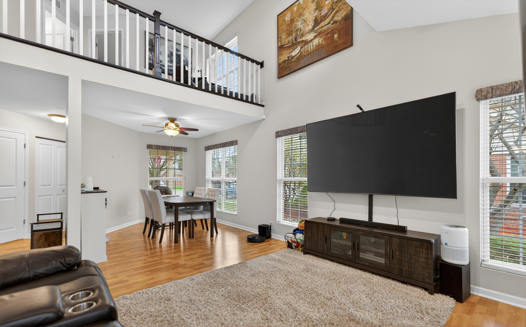 125 Ione Drive, Unit A South Elgin, IL 60177 - Photo 11 of 44 a living room with furniture and a flat screen tv