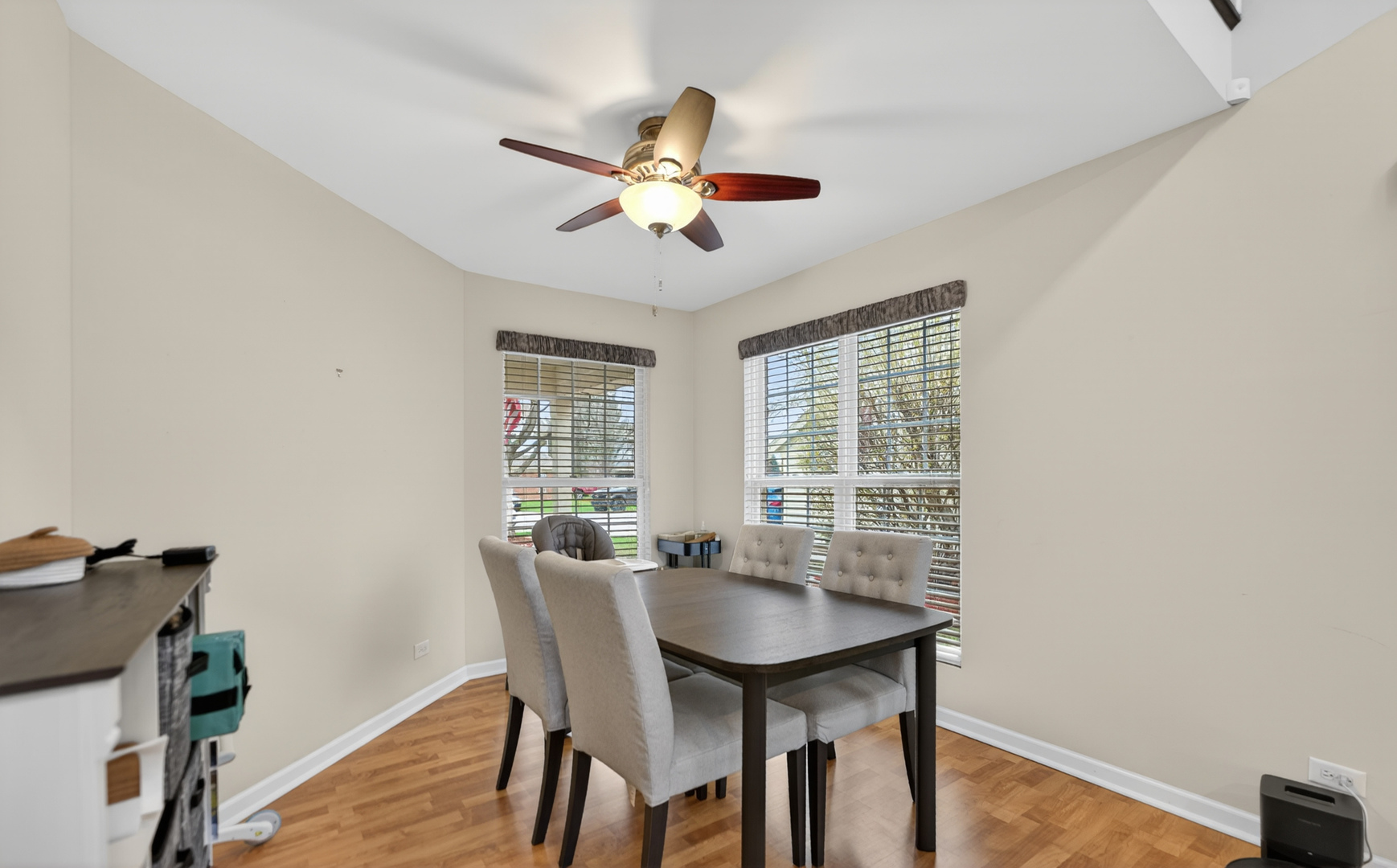 125 Ione Drive, Unit A South Elgin, IL 60177 - Photo 12 of 44 a view of a dining room with furniture window and wooden floor