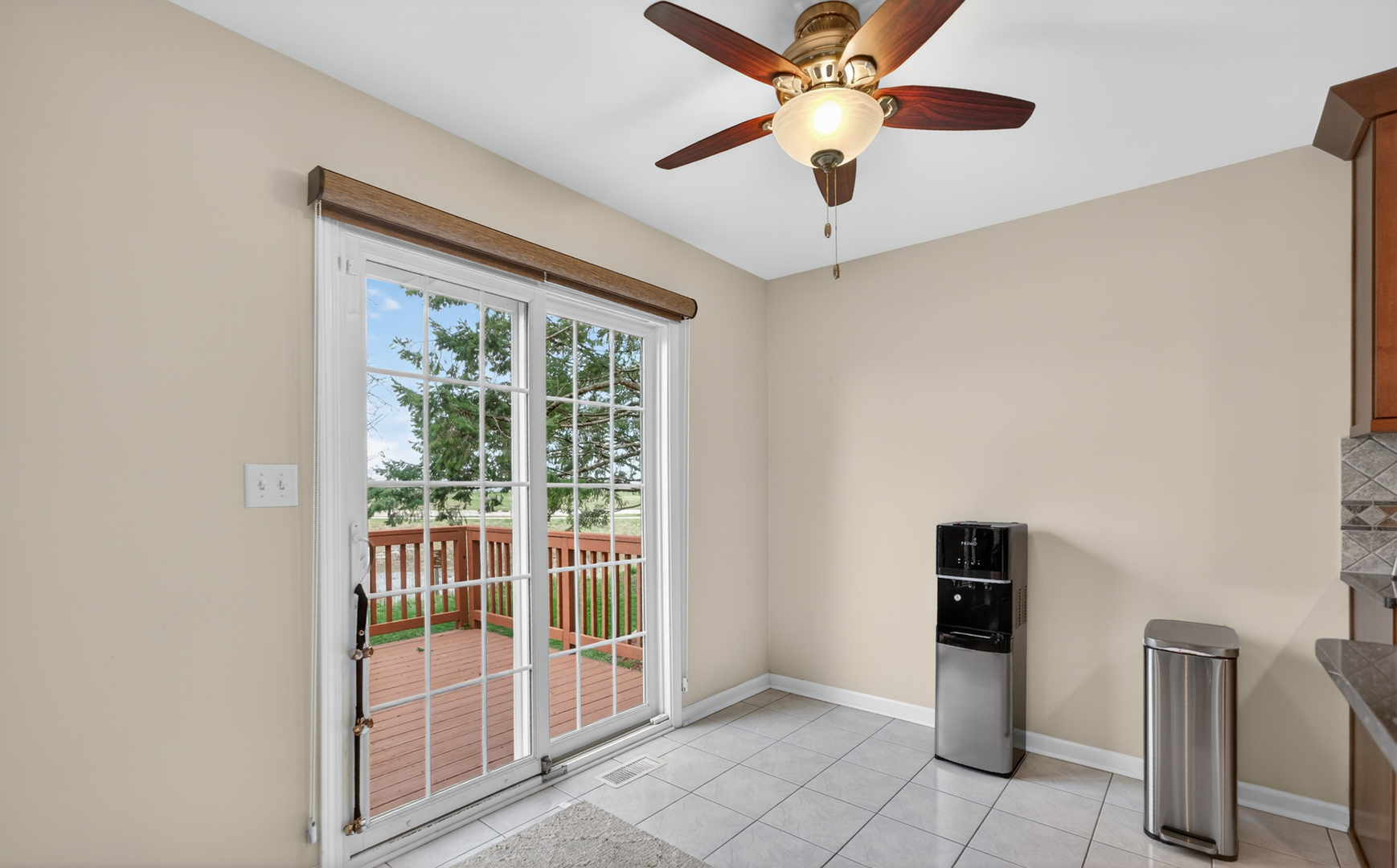 125 Ione Drive, Unit A South Elgin, IL 60177 - Photo 15 of 44 a view of a livingroom with a ceiling fan and window