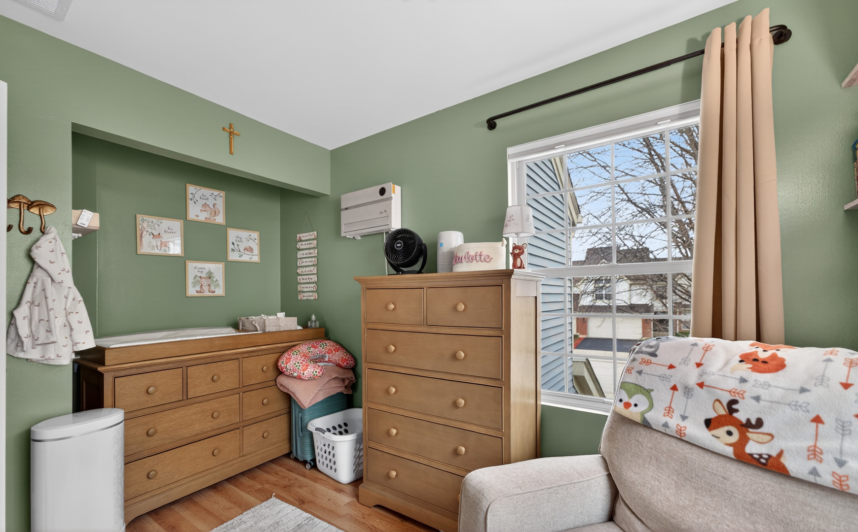 125 Ione Drive, Unit A South Elgin, IL 60177 - Photo 29 of 44 a room with a baby crib dresser and a window