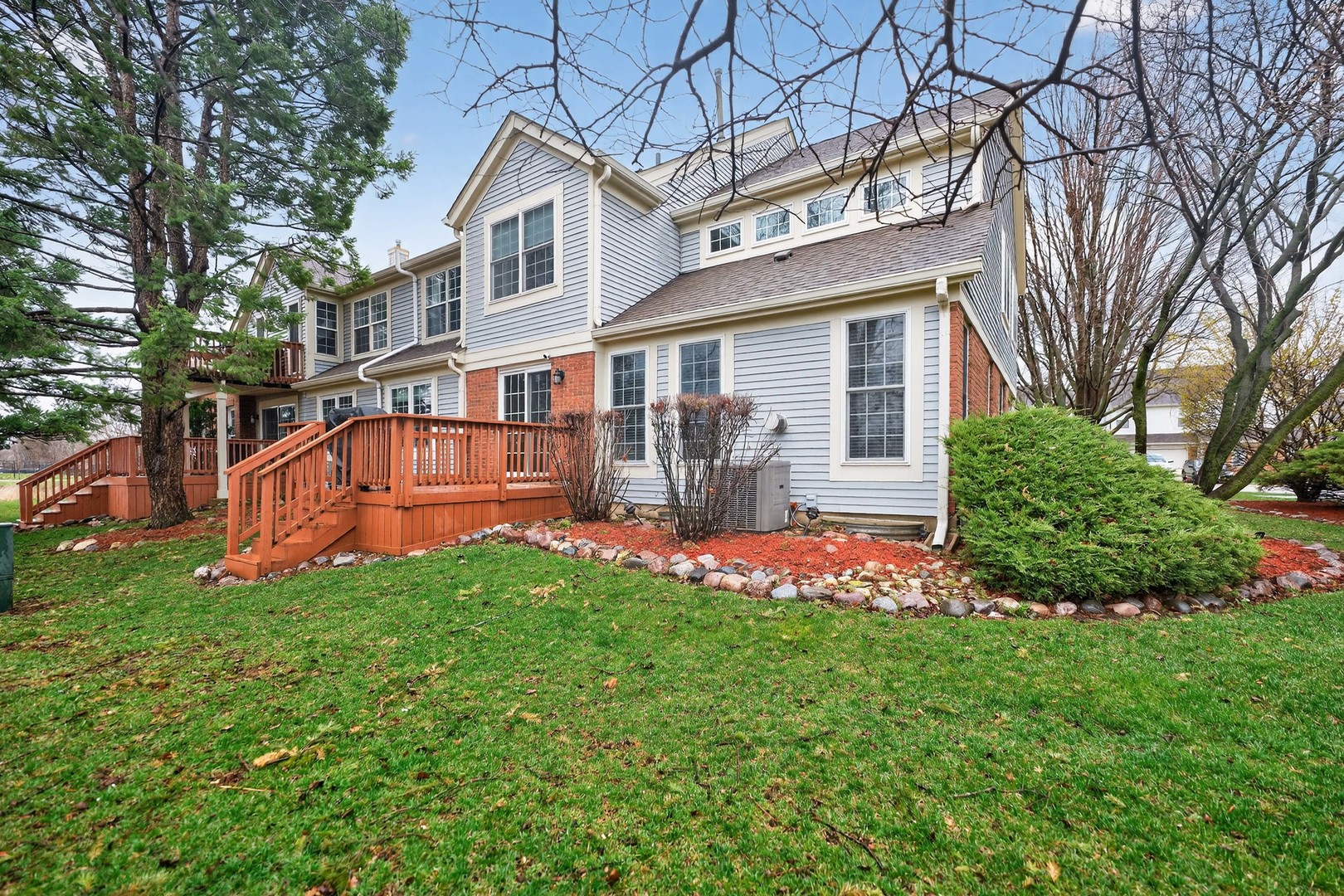 125 Ione Drive, Unit A South Elgin, IL 60177 - Photo 37 of 44 a view of a house with a yard