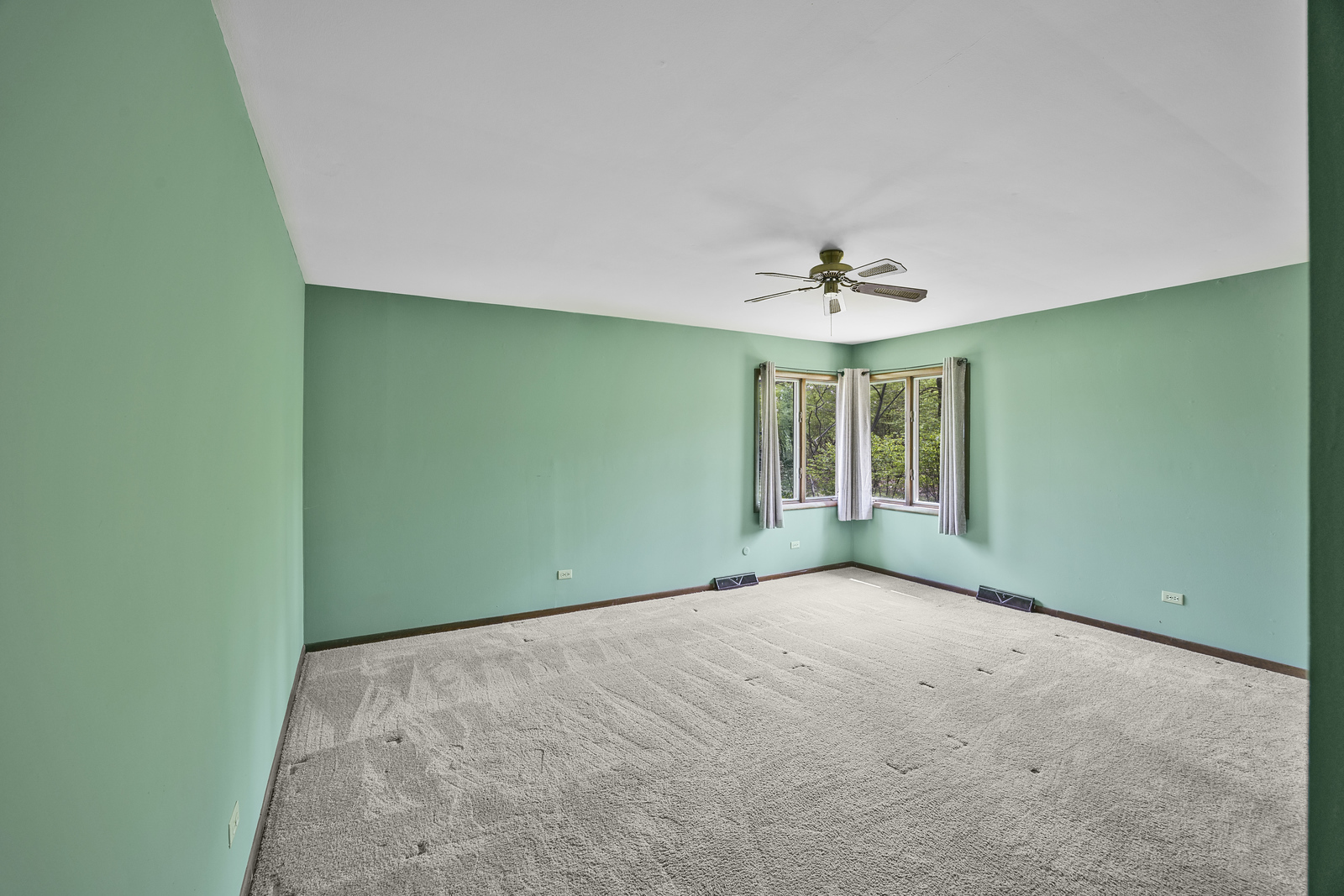 5514 North 13000th Road East Momence, IL 60954 - Photo 12 of 27 an empty room with a window and a ceiling fan