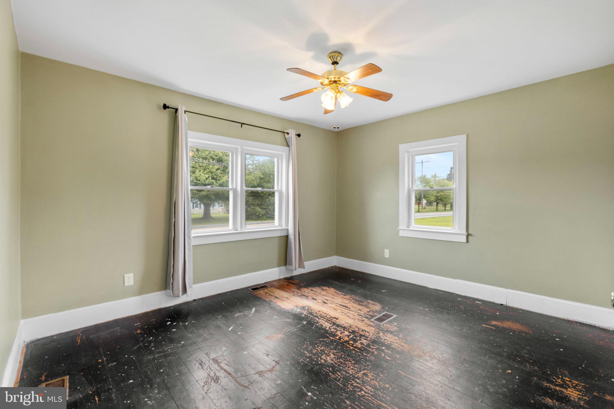 934 Fieldsboro Road Townsend, DE 19734 - Photo 11 of 27 a view of an empty room with wooden floor and a window
