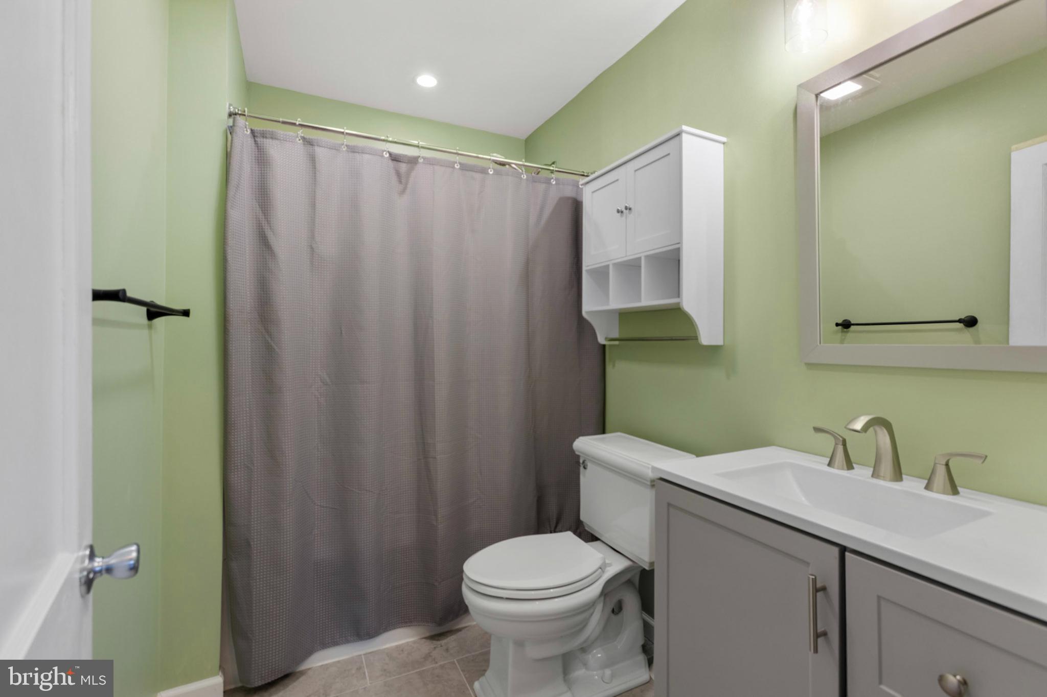 934 Fieldsboro Road Townsend, DE 19734 - Photo 17 of 27 a bathroom with a sink a toilet and shower
