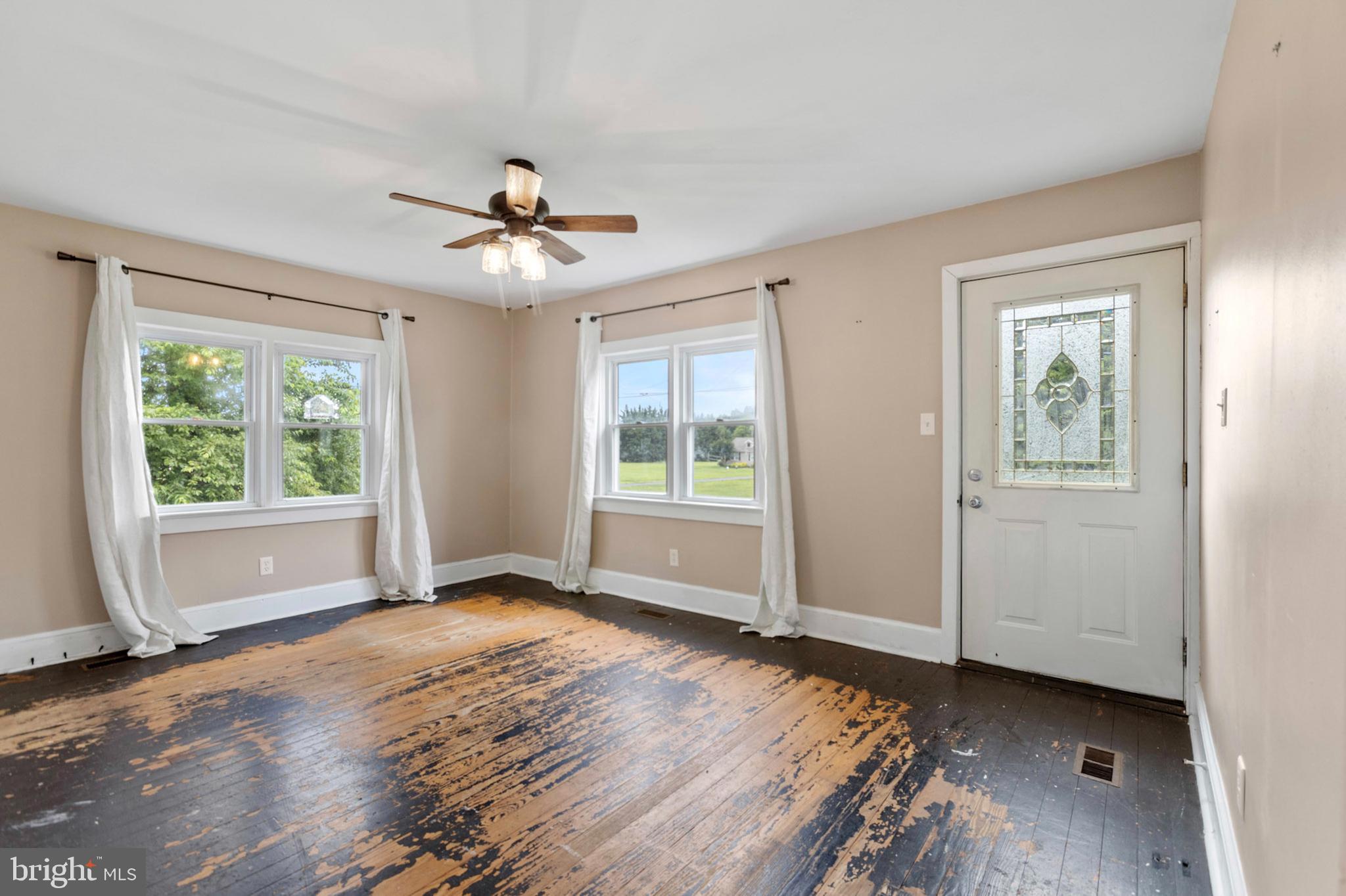 934 Fieldsboro Road Townsend, DE 19734 - Photo 7 of 27 a view of a room with window ceiling fan and wooden floor