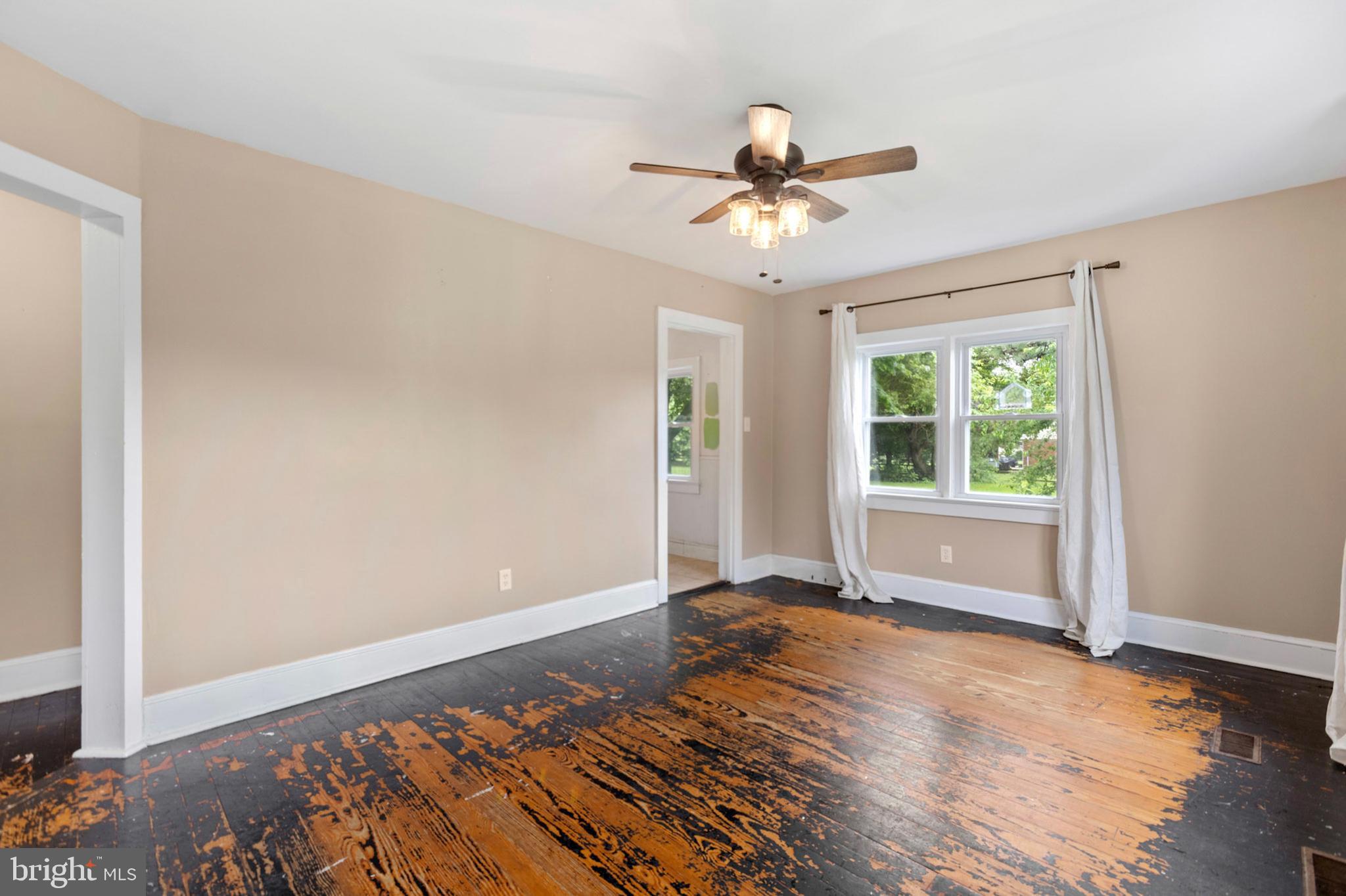 934 Fieldsboro Road Townsend, DE 19734 - Photo 9 of 27 a view of an empty room with window and wooden floor