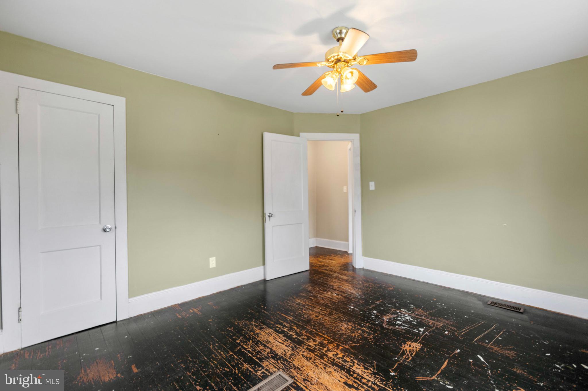 934 Fieldsboro Road Townsend, DE 19734 - Photo 10 of 27 an empty room with wooden floor and chandelier fan