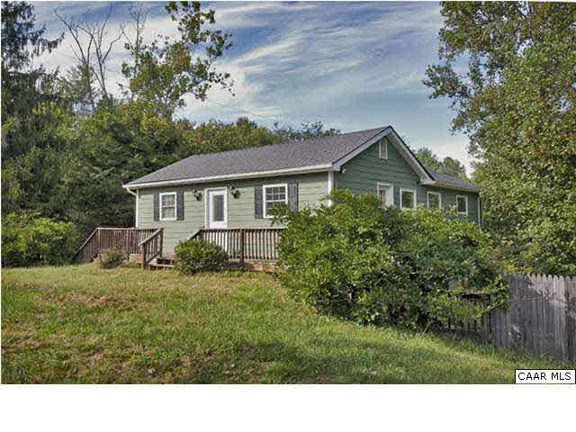 4296 Garth Road Crozet, VA 22932 - Photo 1 of 46 a black and white house with a big yard and large trees