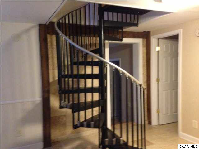 4296 Garth Road Crozet, VA 22932 - Photo 32 of 46 a view of staircase with lots of frames on wall and a window