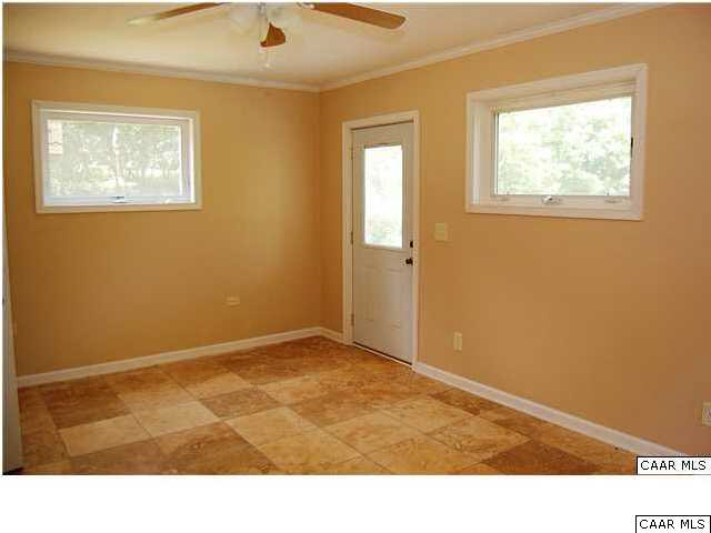 4296 Garth Road Crozet, VA 22932 - Photo 34 of 46 a room with window and a painting on the wall