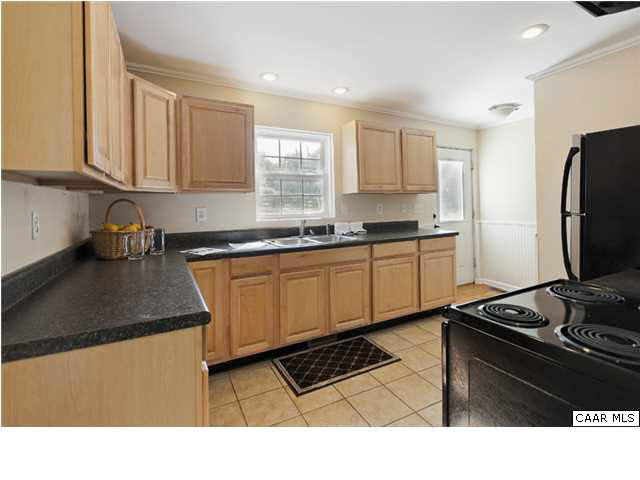 4296 Garth Road Crozet, VA 22932 - Photo 5 of 46 a kitchen with stainless steel appliances granite countertop a sink stove and refrigerator