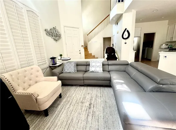 a bed room with furniture and a window