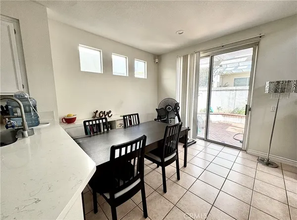 a view of a chairs and table in the patio