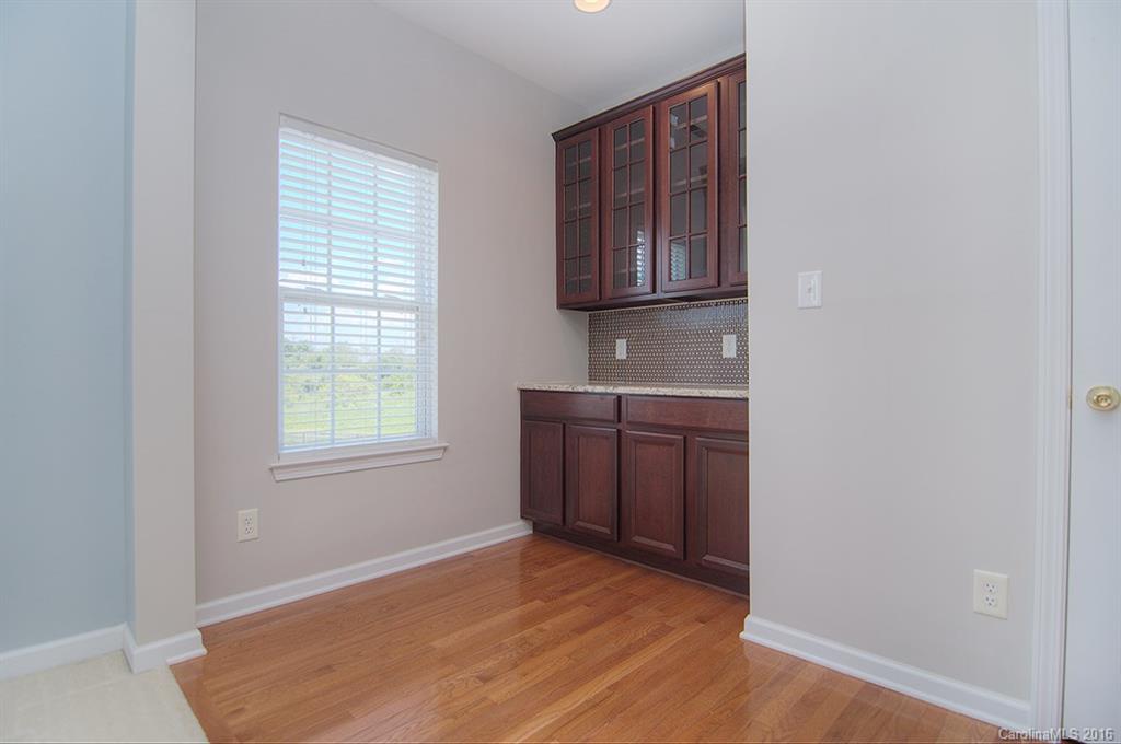7510 Turley Ridge Lane Charlotte, NC 28273 - Photo 11 of 23 an empty room with windows and cabinet