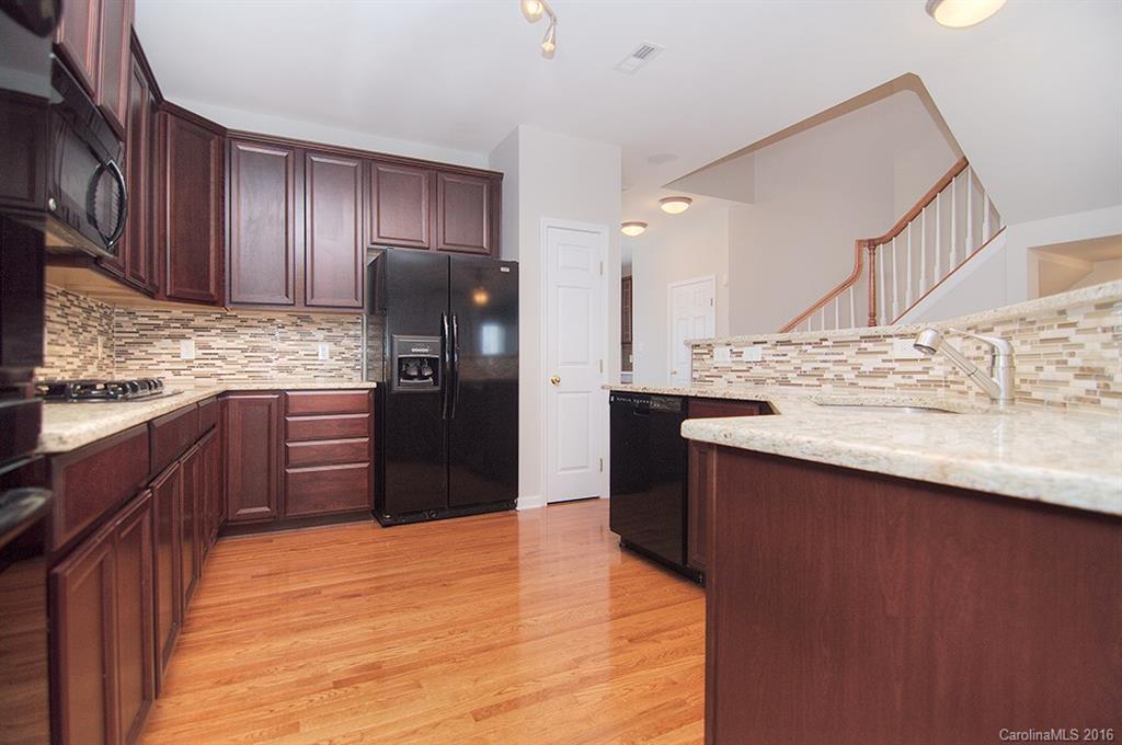 7510 Turley Ridge Lane Charlotte, NC 28273 - Photo 3 of 23 a kitchen with stainless steel appliances granite countertop a refrigerator and a sink