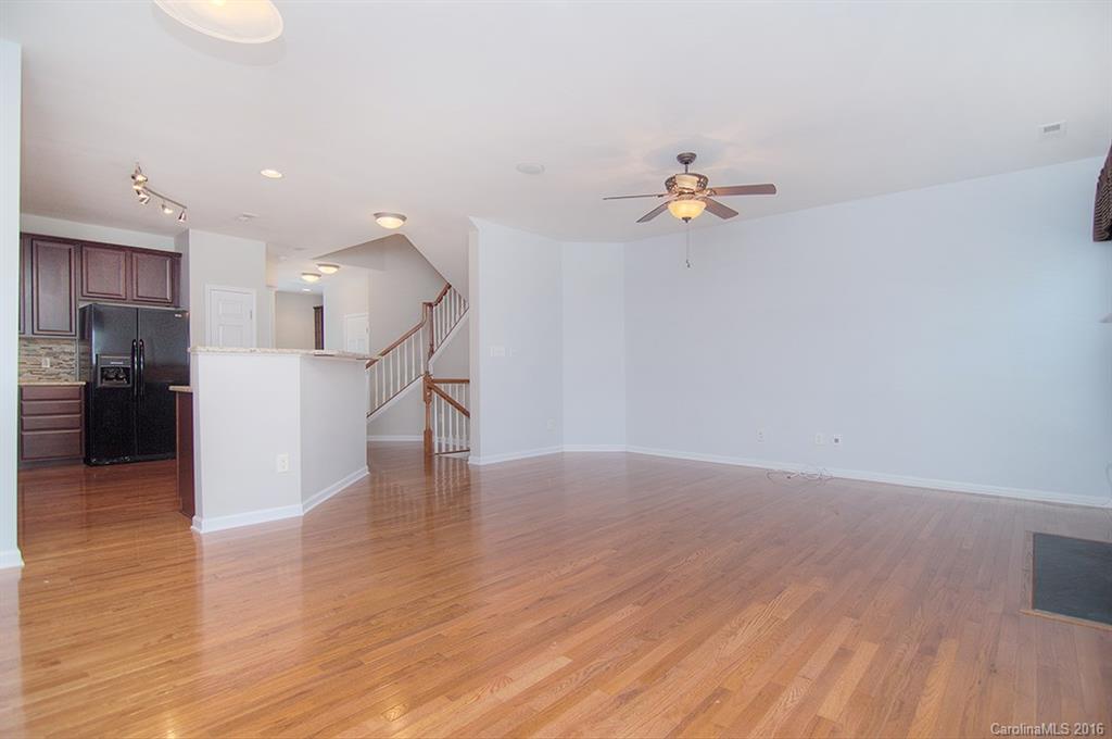 7510 Turley Ridge Lane Charlotte, NC 28273 - Photo 5 of 23 a view of a kitchen with wooden floor and a ceiling fan