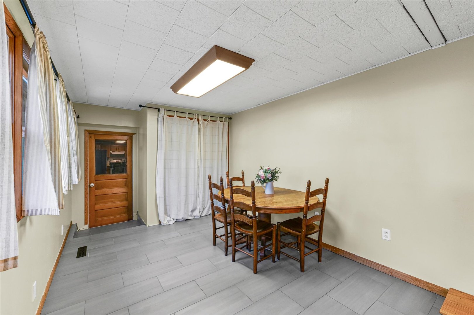 505 North Calhoun Street Tolono, IL 61880 - Photo 12 of 31 a view of a dining room with furniture and window