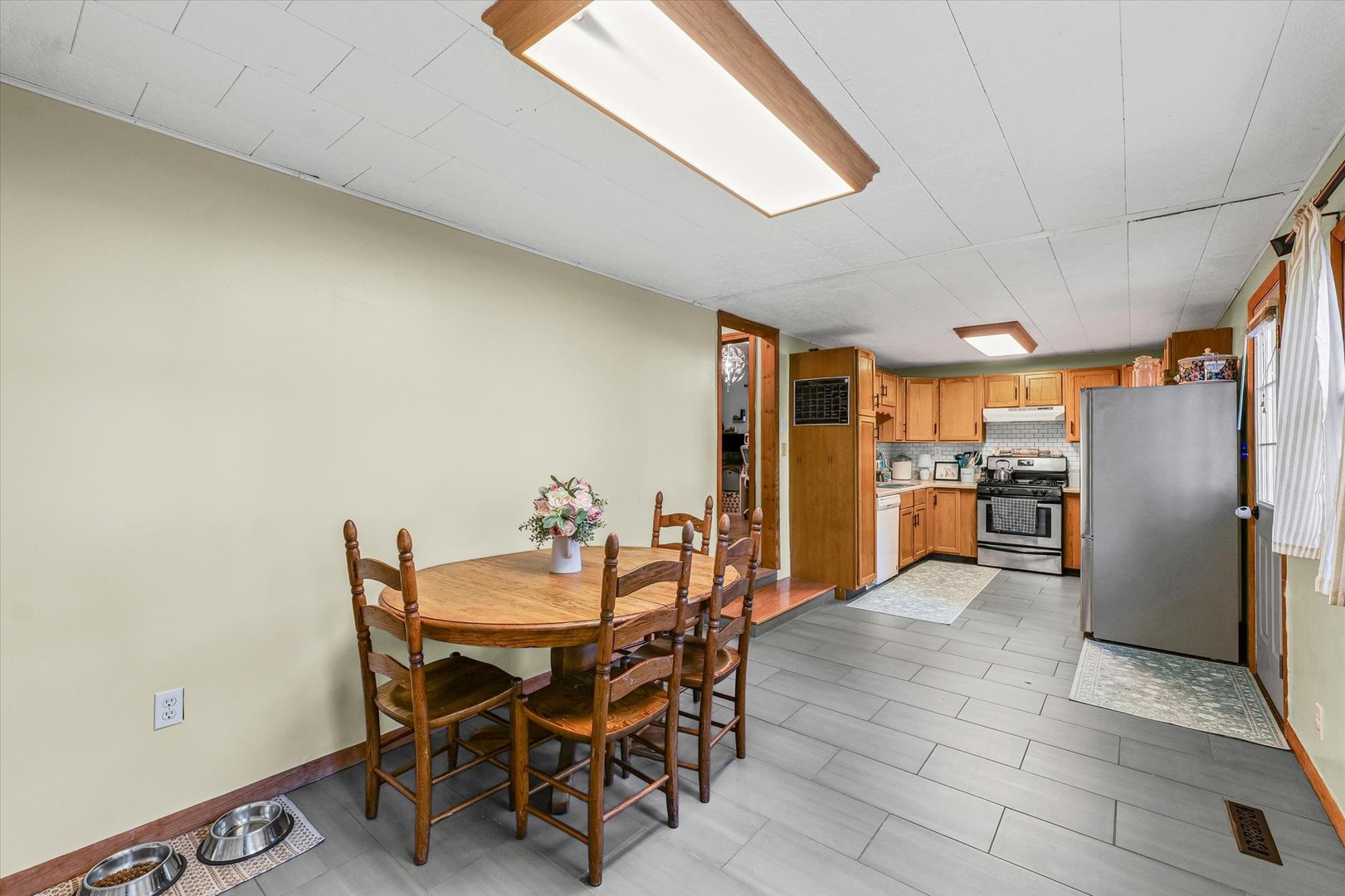 505 North Calhoun Street Tolono, IL 61880 - Photo 13 of 31 a view of a dining room with furniture and a kitchen