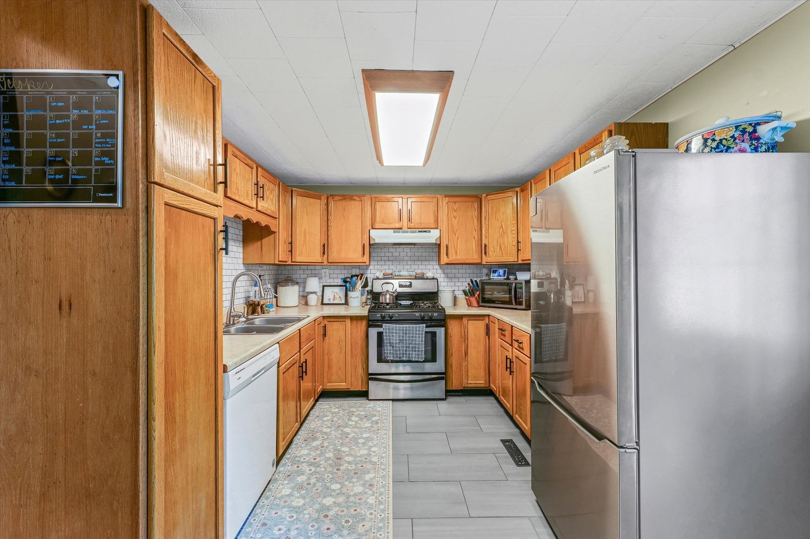 505 North Calhoun Street Tolono, IL 61880 - Photo 14 of 31 a kitchen with stainless steel appliances granite countertop a refrigerator and a stove
