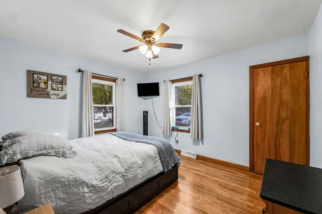 a bedroom with a large bed and a window