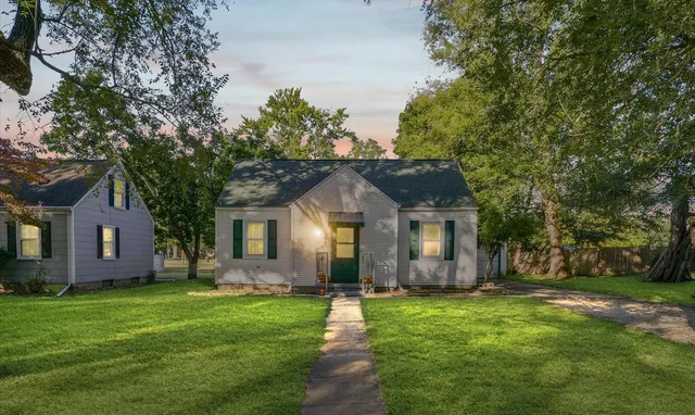 front view of a house with a yard