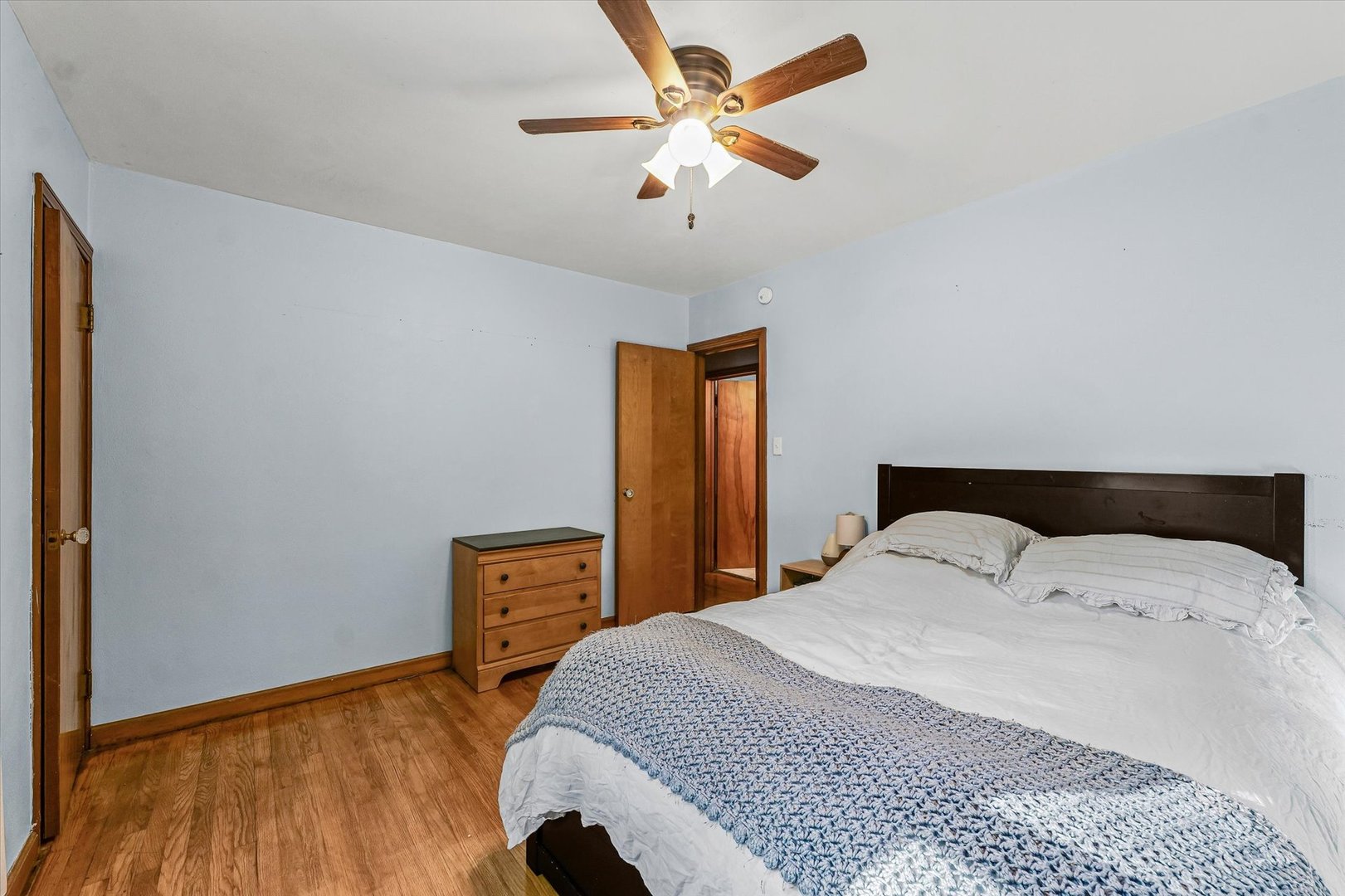 505 North Calhoun Street Tolono, IL 61880 - Photo 21 of 31 a bedroom with a bed and a chandelier