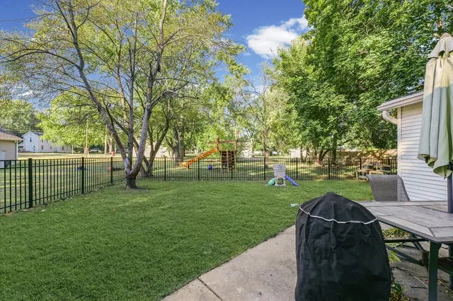 a view of a park with plants and trees