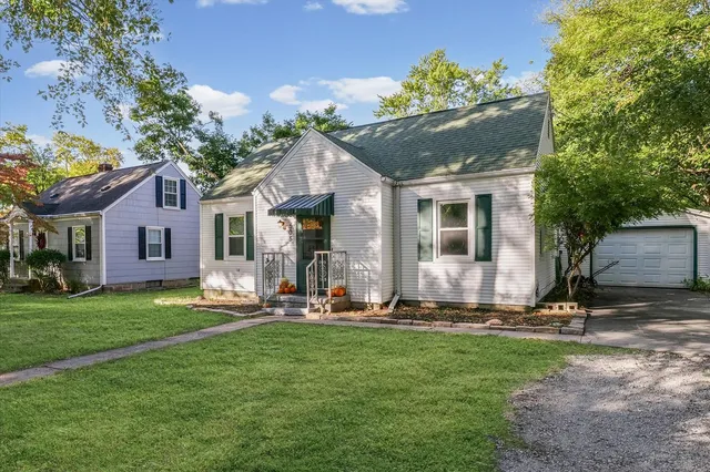 a front view of house with yard having outdoor seating
