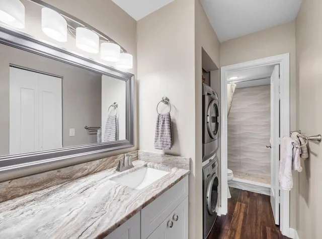 a bedroom with bed and wooden floor