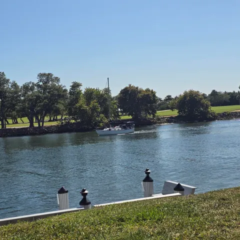 a swimming pool with outdoor seating and yard
