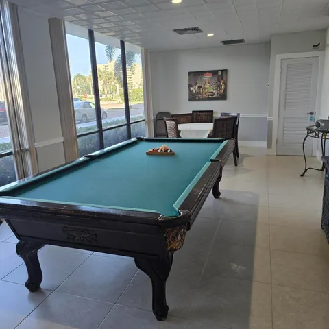 a view of a workspace with furniture and bathroom
