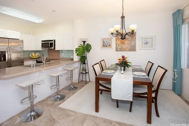 a living room with furniture a flat screen tv and a window