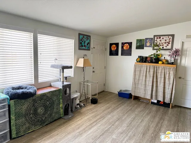 a bedroom with a bed and a table in it